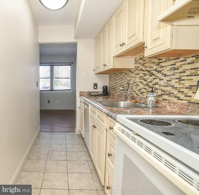 kitchen with tasteful backsplash, dishwasher, sink, white electric range oven, and light tile patterned floors