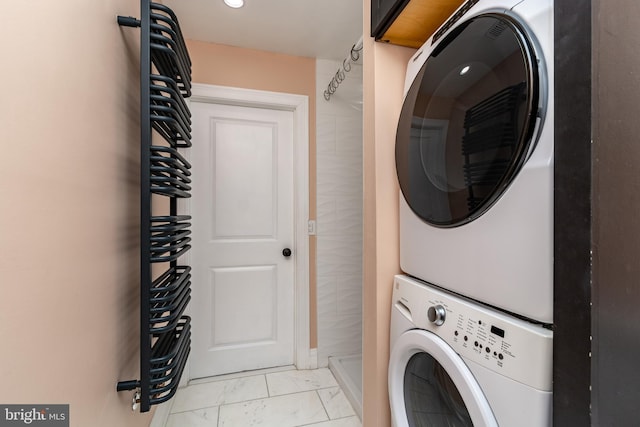 laundry area with stacked washer / drying machine