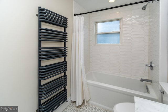 bathroom featuring tile patterned flooring, toilet, radiator, and shower / tub combo