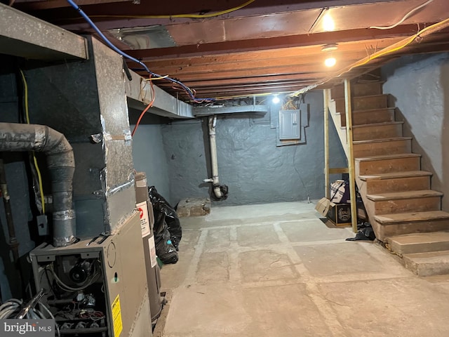 basement featuring electric panel