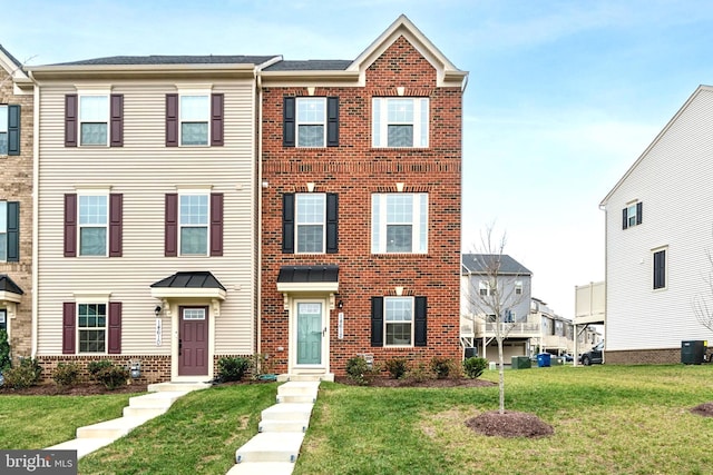 view of property featuring a front lawn