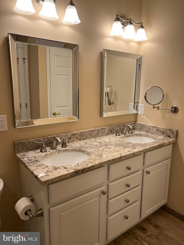 bathroom featuring hardwood / wood-style floors and vanity