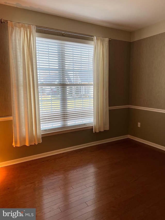 unfurnished room featuring hardwood / wood-style floors