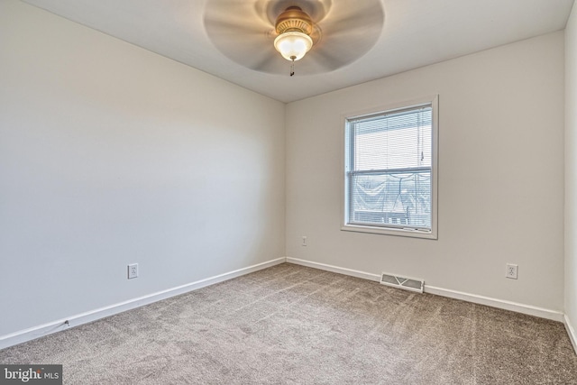 unfurnished room featuring carpet flooring and ceiling fan