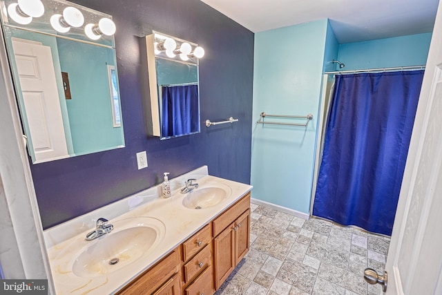 bathroom featuring a shower with curtain and vanity