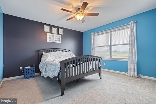 bedroom featuring ceiling fan and light colored carpet