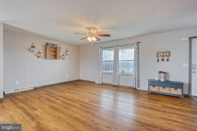 spare room featuring hardwood / wood-style flooring and ceiling fan