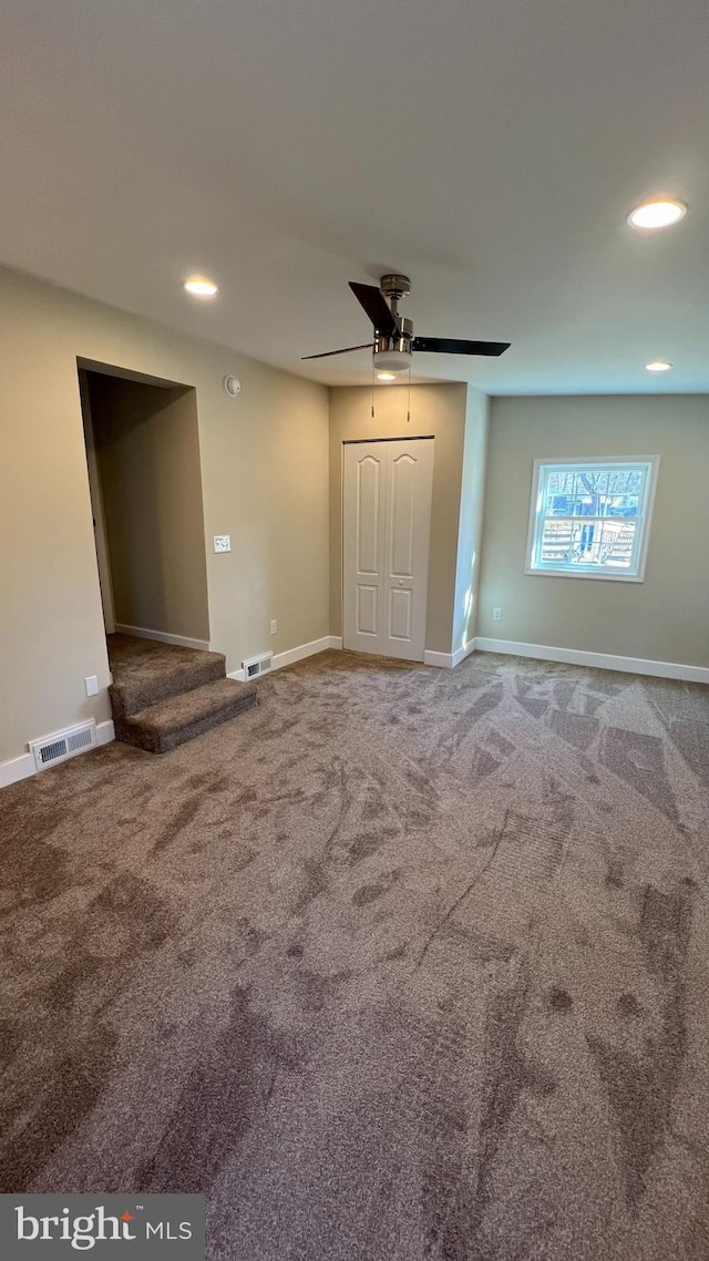 unfurnished living room with visible vents, baseboards, a ceiling fan, carpet, and recessed lighting