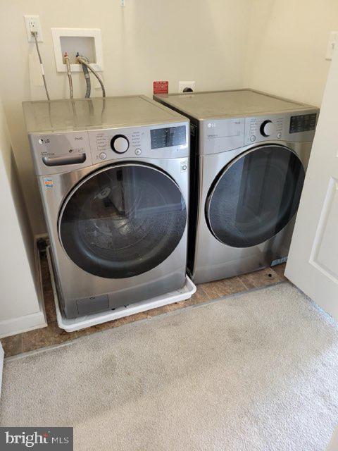 laundry room featuring washer and clothes dryer