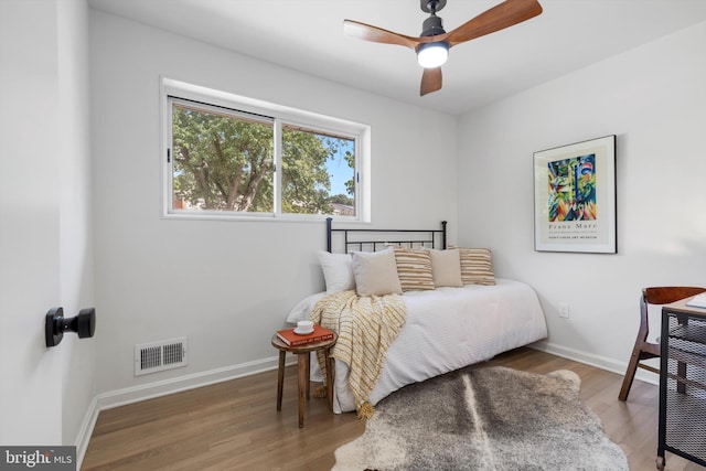 bedroom featuring ceiling fan and wood-type flooring