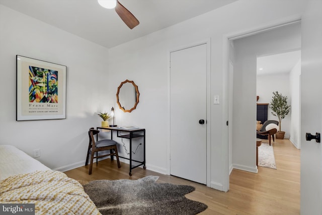 bedroom featuring wood-type flooring and ceiling fan