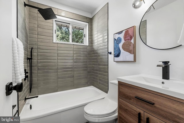 full bathroom featuring vanity, toilet, and tiled shower / bath