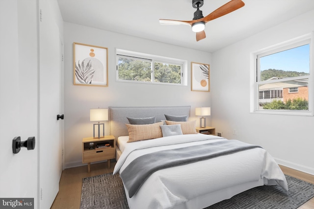 bedroom featuring ceiling fan and wood-type flooring