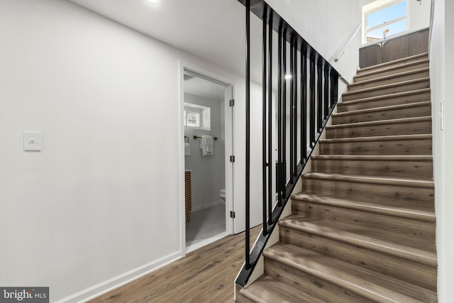 stairs with wood-type flooring