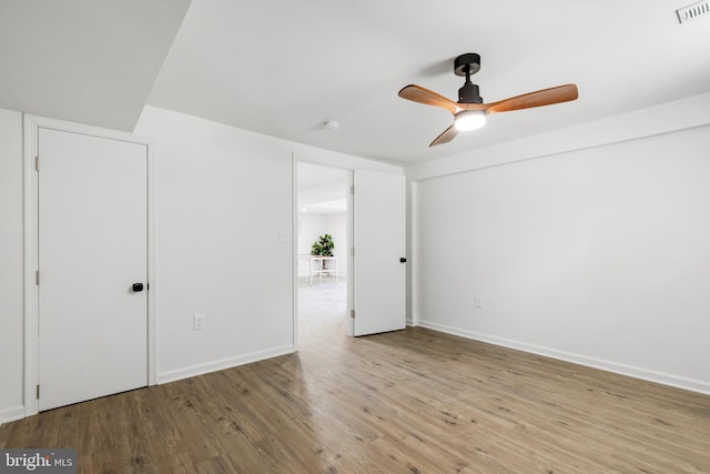 interior space with ceiling fan and light hardwood / wood-style floors