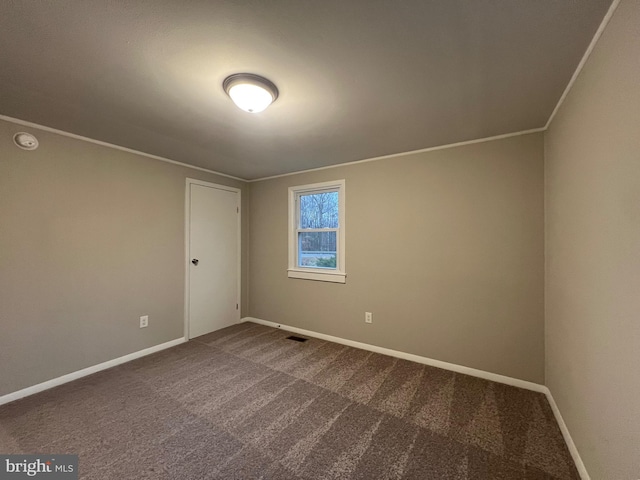 unfurnished room with carpet floors and ornamental molding