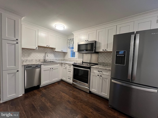 kitchen with sink, white cabinets, and appliances with stainless steel finishes