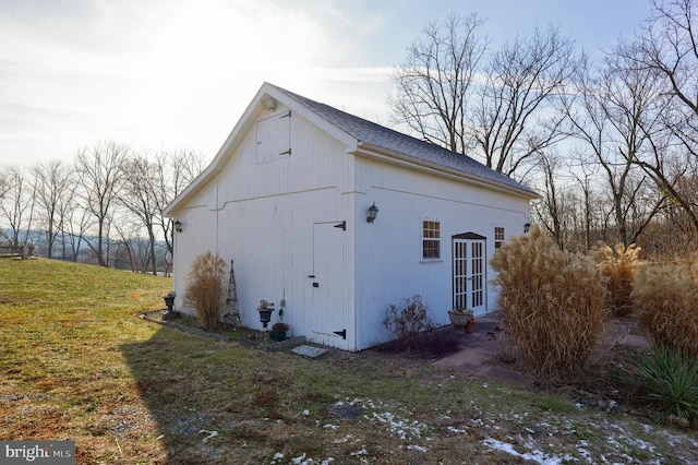 view of property exterior with a lawn