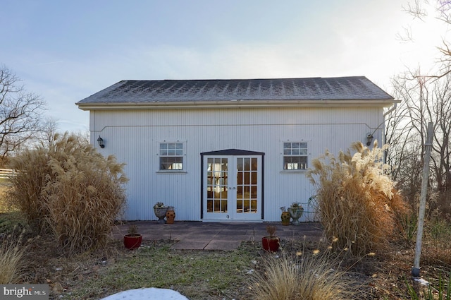 back of property with french doors and a patio area