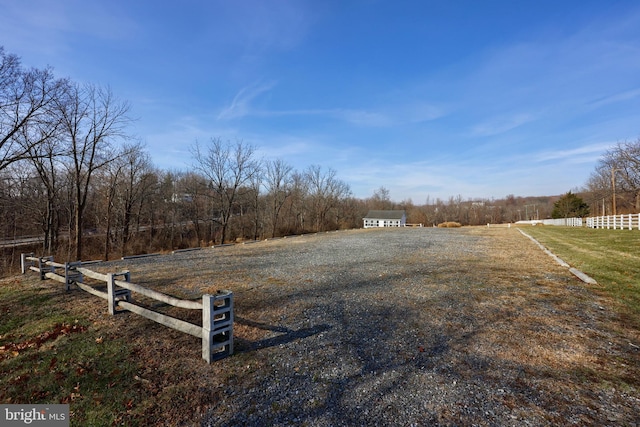 view of yard with a rural view