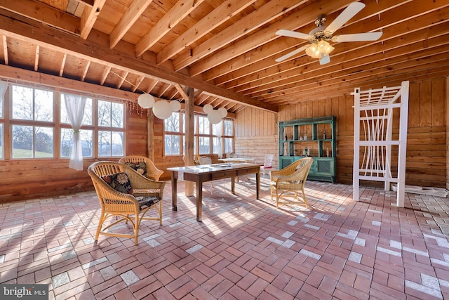 interior space with ceiling fan and a wealth of natural light