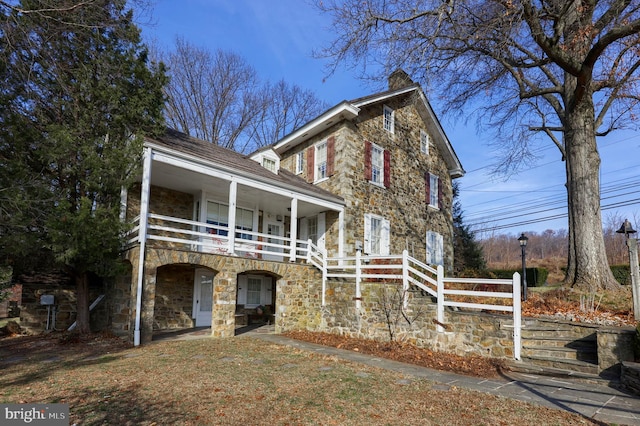 view of front of house with a balcony