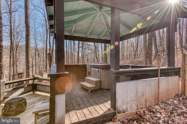 wooden terrace with a hot tub