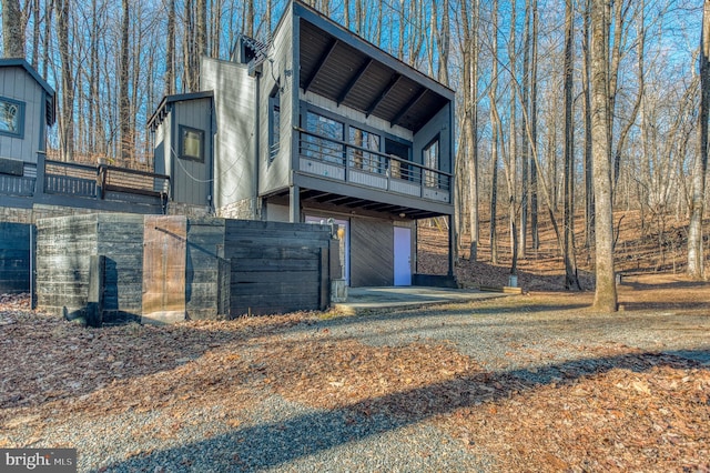 rear view of house featuring a garage