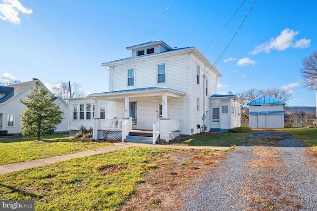 view of front of home featuring a porch and a front lawn