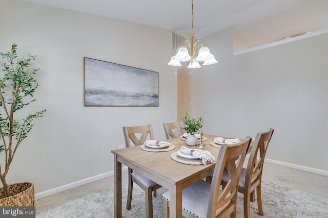 dining area featuring carpet floors and a notable chandelier