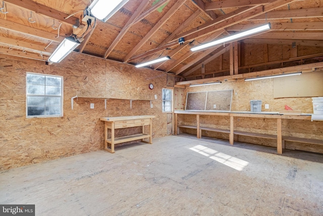 misc room with a workshop area and vaulted ceiling