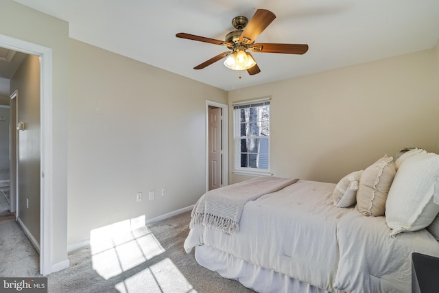 bedroom with ceiling fan and light carpet