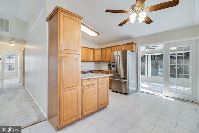 kitchen with ceiling fan, tasteful backsplash, stainless steel refrigerator with ice dispenser, lofted ceiling, and light carpet