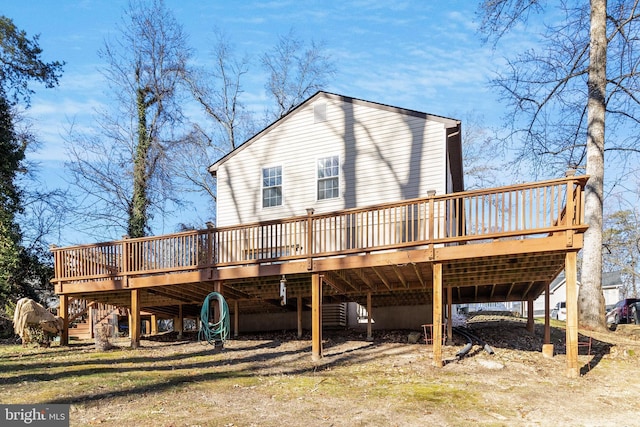 rear view of house with a wooden deck