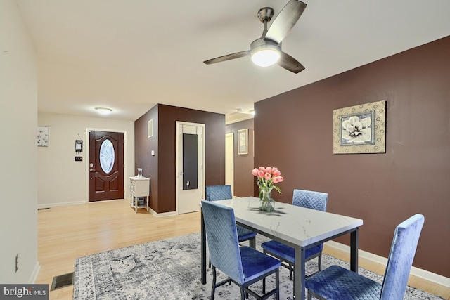 dining room featuring ceiling fan and light hardwood / wood-style flooring