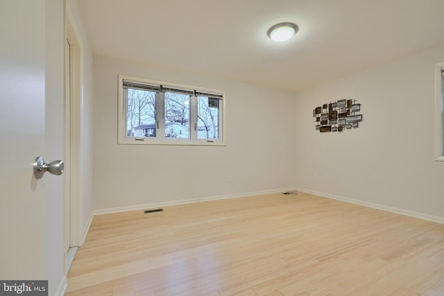 empty room with light wood-type flooring