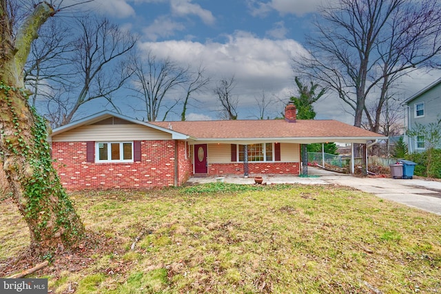 ranch-style home featuring a front yard and a carport