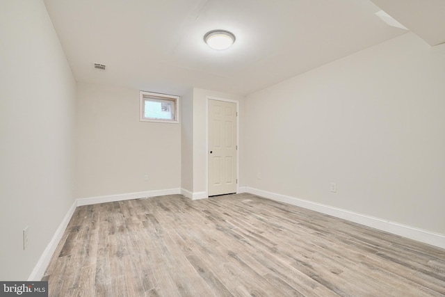 spare room with light hardwood / wood-style floors