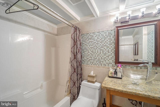 full bathroom featuring crown molding, sink, toilet, tile walls, and shower / tub combo with curtain