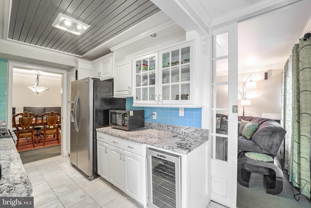 kitchen with stainless steel appliances, beverage cooler, backsplash, crown molding, and white cabinets