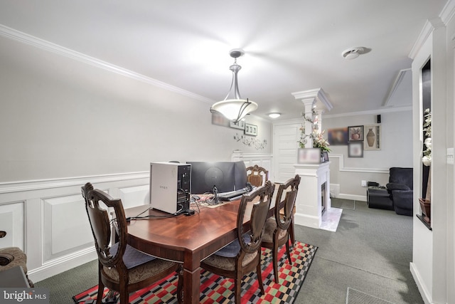 carpeted dining area with ornamental molding