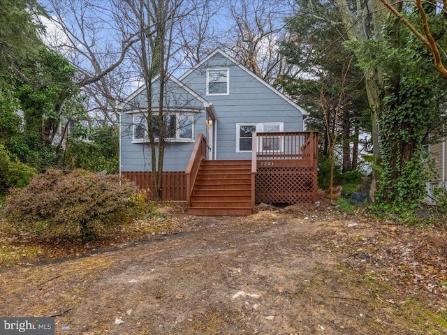 back of property featuring a deck