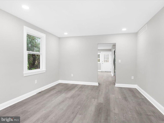 empty room featuring hardwood / wood-style flooring