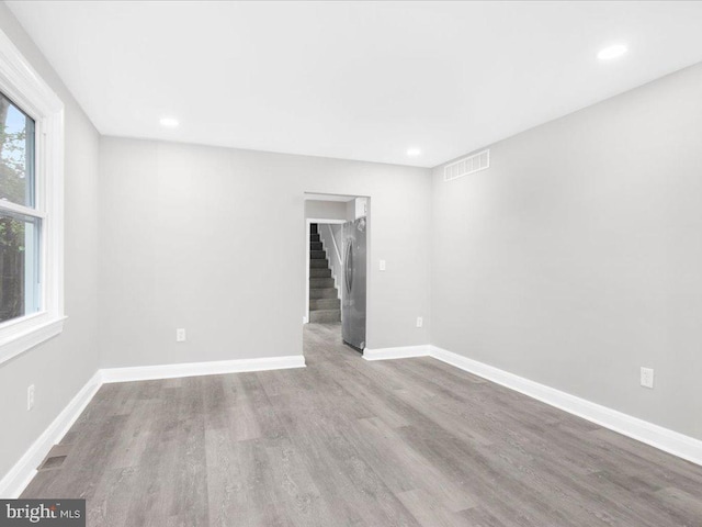 unfurnished room featuring light wood-type flooring