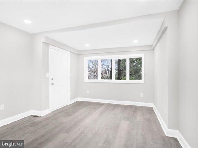 empty room featuring hardwood / wood-style flooring