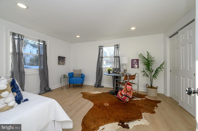 bedroom featuring light hardwood / wood-style flooring and a closet