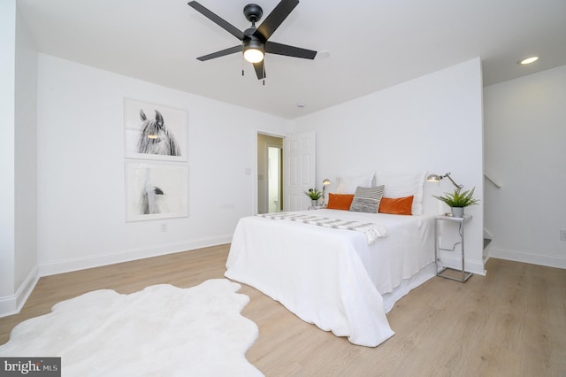 bedroom featuring ceiling fan and light hardwood / wood-style floors