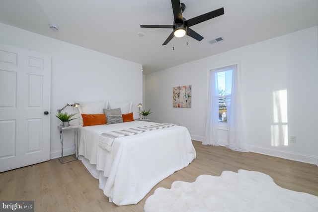 bedroom featuring light wood-type flooring and ceiling fan