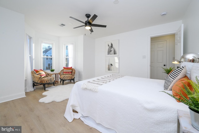 bedroom featuring ceiling fan and light hardwood / wood-style flooring