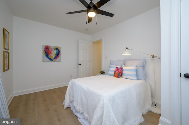 bedroom featuring light hardwood / wood-style flooring and ceiling fan